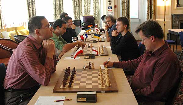 The top boards await the starting gun: nearest the camera, Wells (white) v Krasenkow, 